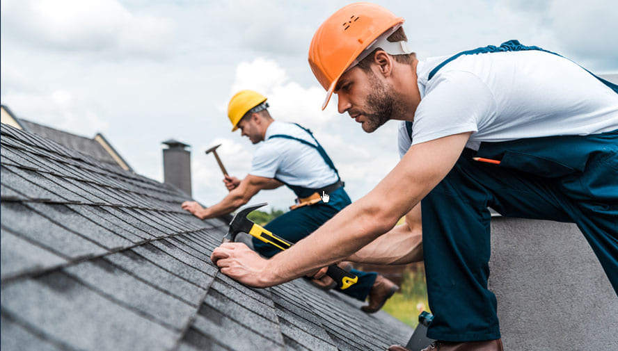 Austin texas roofing repair. Roof repaired by two roofers. Gray roof slanted.